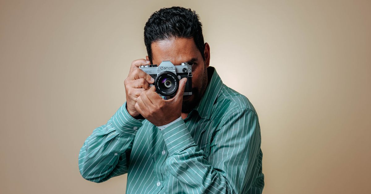 A photographer working with a camera on a shoot