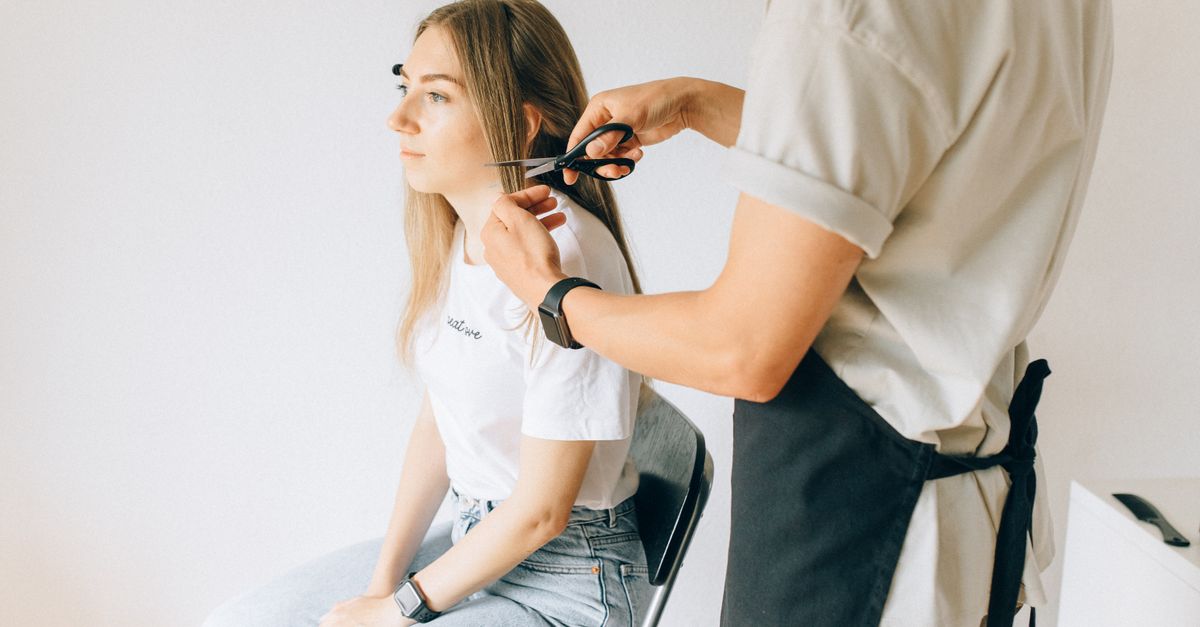 A stylist working with a client in a hair salon